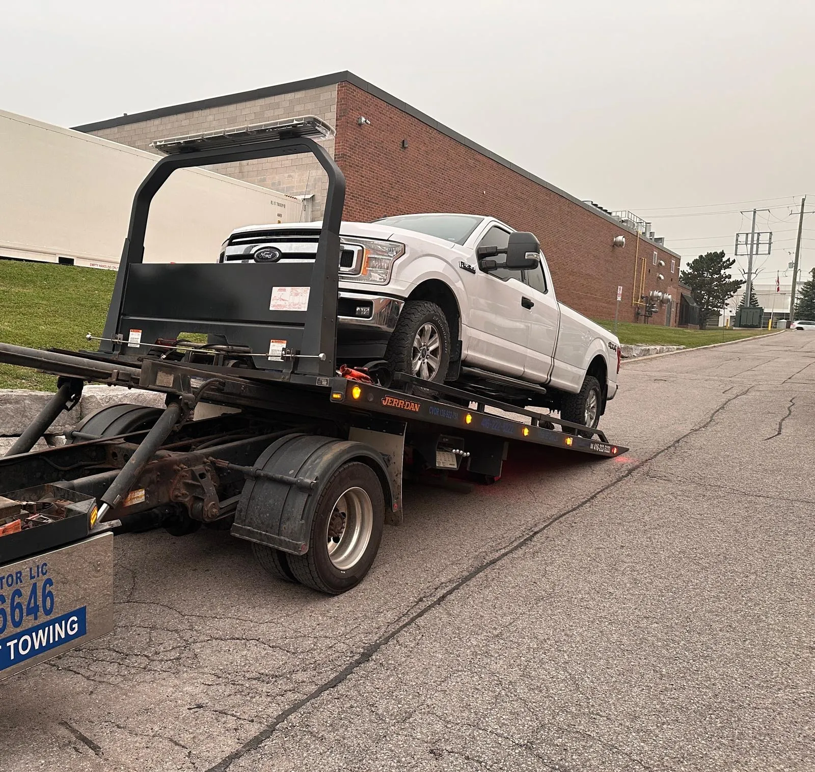 Trueman Towing flatbed truck on GTA road